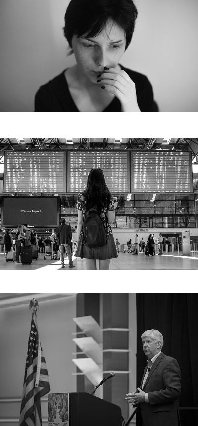 A woman biting her nails, a young girl standing in an airport in front of a complicated screen, a man giving a speach